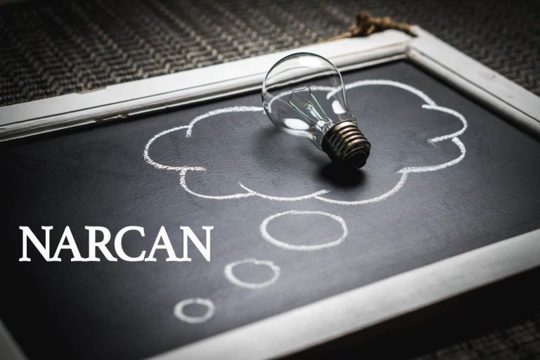 Lightbulb on chalkboard with Narcan written below