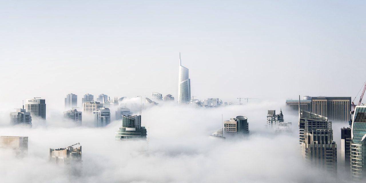 skyline of city with cloud covering