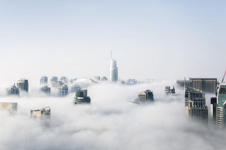 skyline of city with cloud covering