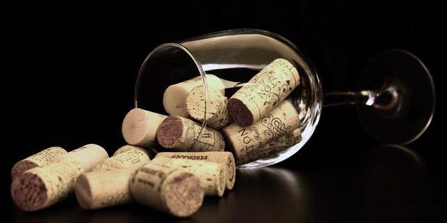 parenthoodmommywine corks in wine glass tipped over