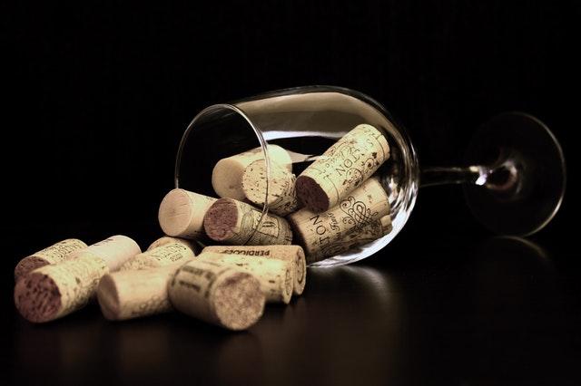 corks in wine glass tipped over