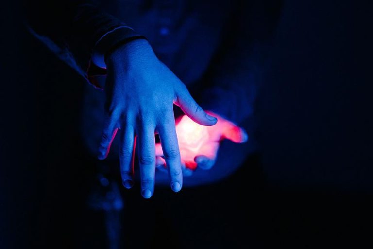 hands glowing in the dark