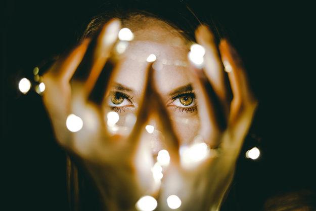 powerofthemind girl holding a string of lights