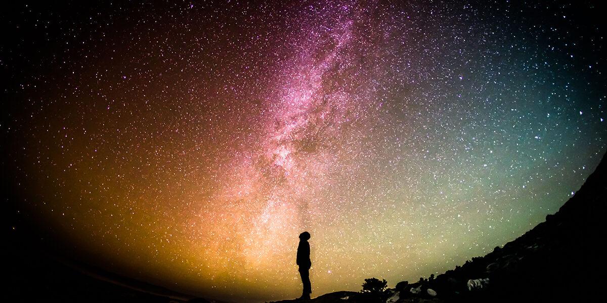 man looking at stars